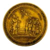 1934 United Lutheran Church bronze medal showing a religious figure facing an emigrant family beneath an angel, with Savannah convention inscriptions.