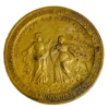 1934 United Lutheran Church bronze medal showing a religious figure facing an emigrant family beneath an angel, with Savannah convention inscriptions.