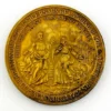 1934 United Lutheran Church bronze medal showing a religious figure facing an emigrant family beneath an angel, with Savannah convention inscriptions.