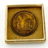 1934 United Lutheran Church bronze medal showing a religious figure facing an emigrant family beneath an angel, with Savannah convention inscriptions.