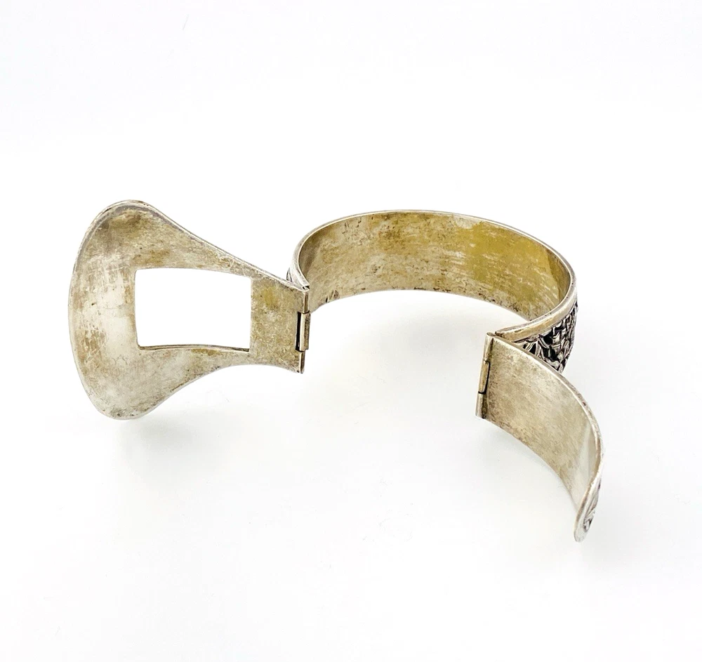 Chinese export silver buckle bracelet with pierced bamboo, flowers, figures and raised Chinese characters