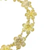 Pale gold-over-silver bracelet with eight six-petal filigree flowers, raised bead centers, and paired connecting links.