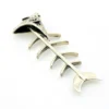 Vintage sterling silver fish skeleton pendant with cast head and articulated fabricated body