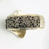 Chinese export silver buckle bracelet with pierced bamboo, flowers, figures and raised Chinese characters