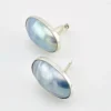 Great Falls Metal Works oval light blue mabé pearl earrings in narrow sterling silver bezels, shown upright from the front.