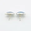 Great Falls Metal Works oval light blue mabé pearl earrings in narrow sterling silver bezels, shown upright from the front.