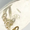 Great Falls Metal Works oval light blue mabé pearl earrings in narrow sterling silver bezels, shown upright from the front.