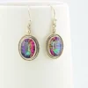 VIVAH oval mystic topaz drop earrings with purple, pink, green, and blue reflections, bordered by concentric sterling silver frames.