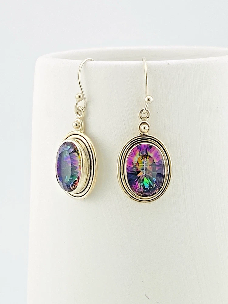 VIVAH oval mystic topaz drop earrings with purple, pink, green, and blue reflections, bordered by concentric sterling silver frames.