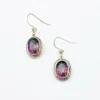 VIVAH oval mystic topaz drop earrings with purple, pink, green, and blue reflections, bordered by concentric sterling silver frames.