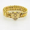 Pitman & Keeler American Queen gold filled expansion bracelet with alternating polished and patterned links and a pinstriped, engraved heart centerpiece.
