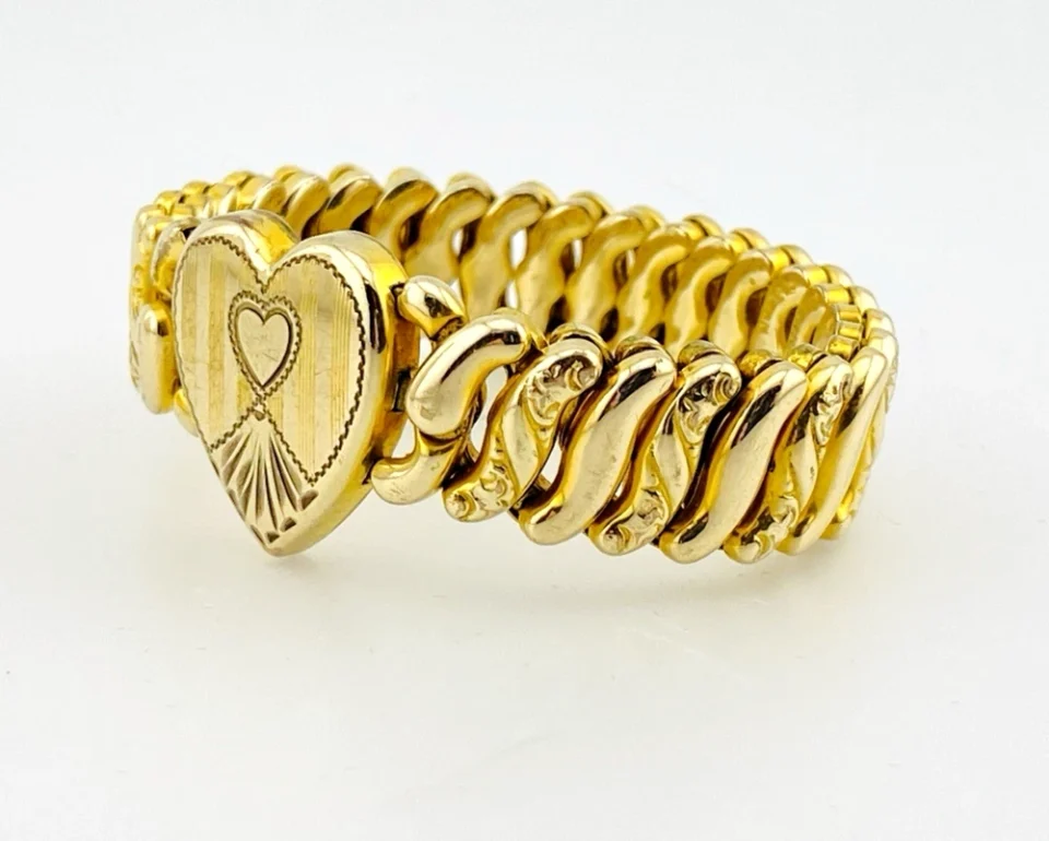 Pitman & Keeler American Queen gold filled expansion bracelet with alternating polished and patterned links and a pinstriped, engraved heart centerpiece.
