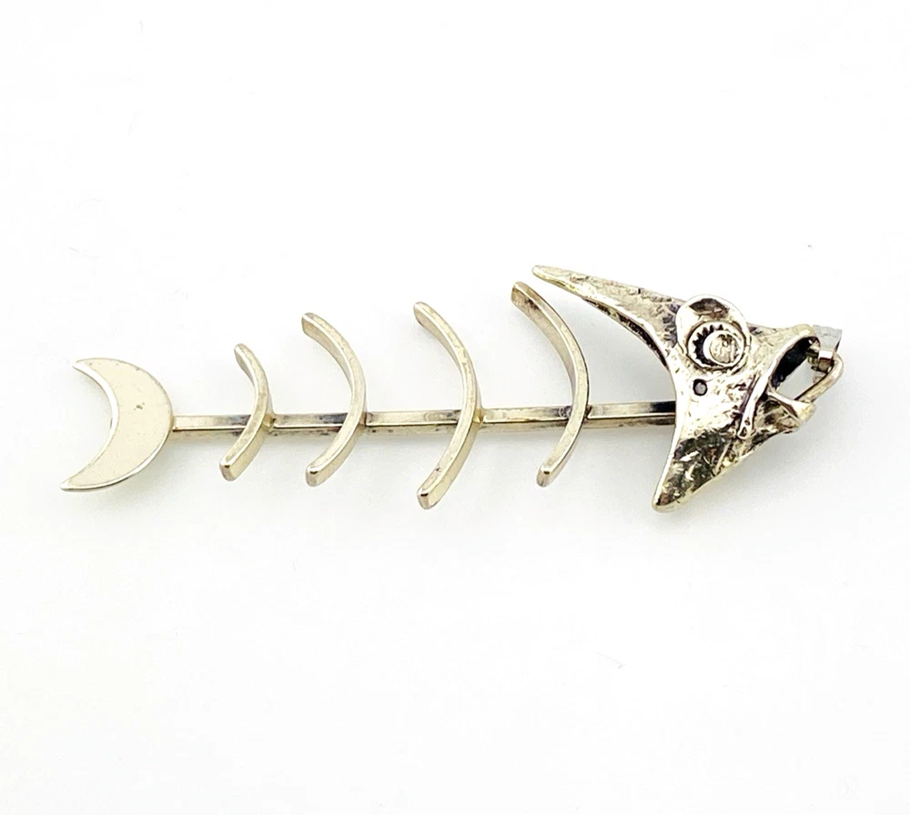 Vintage sterling silver fish skeleton pendant with cast head and articulated fabricated body