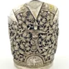 Wide peaked silver cuff with three crowned celestial dancers, openwork leafy scrolls and a rounded longevity medallion