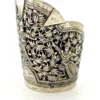 Wide peaked silver cuff with three crowned celestial dancers, openwork leafy scrolls and a rounded longevity medallion