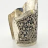 Wide peaked silver cuff with three crowned celestial dancers, openwork leafy scrolls and a rounded longevity medallion