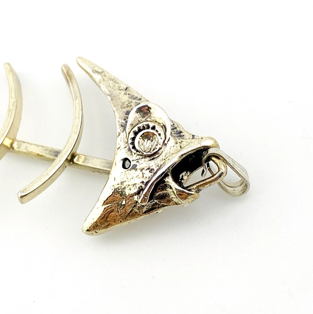 Vintage sterling silver fish skeleton pendant with cast head and articulated fabricated body