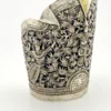 Wide peaked silver cuff with three crowned celestial dancers, openwork leafy scrolls and a rounded longevity medallion