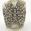 Wide peaked silver cuff with three crowned celestial dancers, openwork leafy scrolls and a rounded longevity medallion