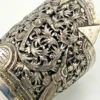 Wide peaked silver cuff with three crowned celestial dancers, openwork leafy scrolls and a rounded longevity medallion