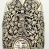 Wide peaked silver cuff with three crowned celestial dancers, openwork leafy scrolls and a rounded longevity medallion