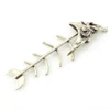 Vintage sterling silver fish skeleton pendant with cast head and articulated fabricated body