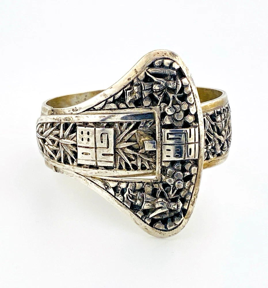 Chinese export silver buckle bracelet with pierced bamboo, flowers, figures and raised Chinese characters