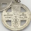 Chapel sterling silver four-way swivel medal with patriotic enamel, devotional figures and a personal inscription dated 1967.